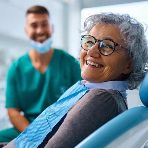 Woman with dentures in Minot