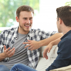 Invisalign patient in Minot talking with friend