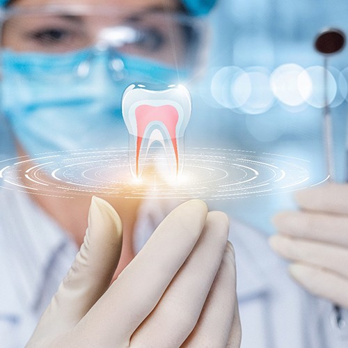 Dental technology concept, showing tooth floating above the hand of a dental professional